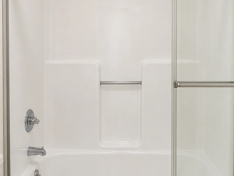The same Outer Sunset fiberglass shower unit after refinishing, restored to a glossy bright-white finish, San Francisco